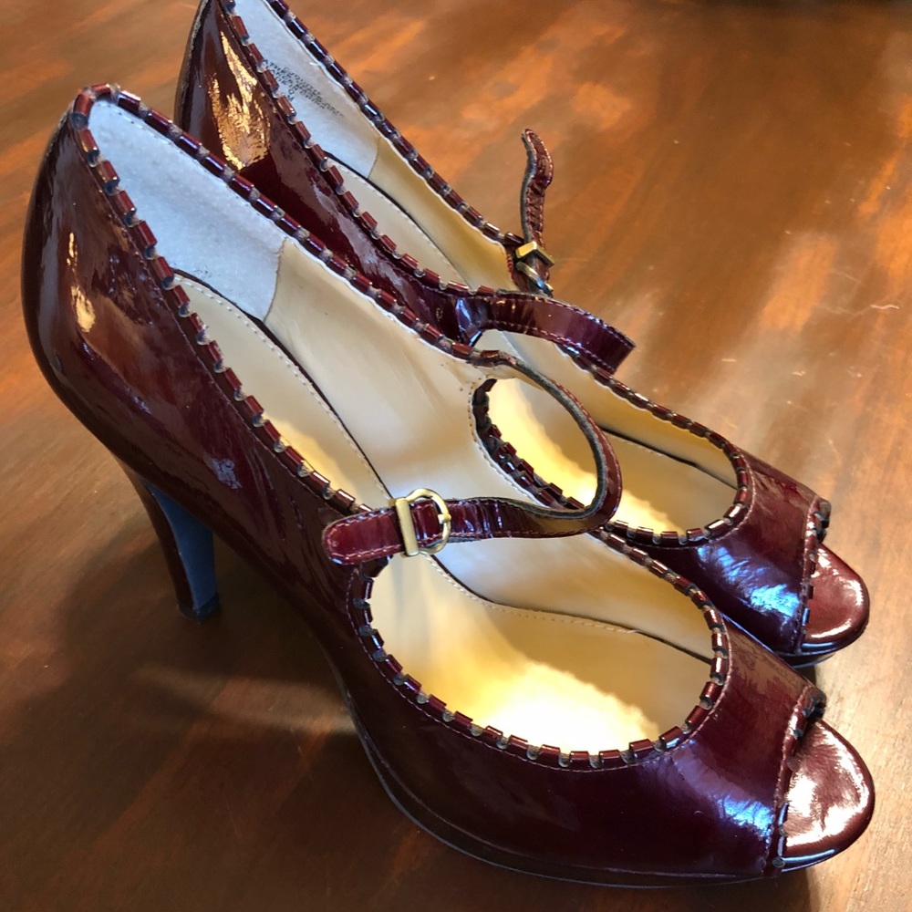 Wine/ burgundy patent leather Mary Jane pumps.